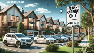 a parking lot with cars parked in front of a row of houses